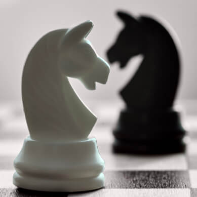 Image of chess pieces on a chess board